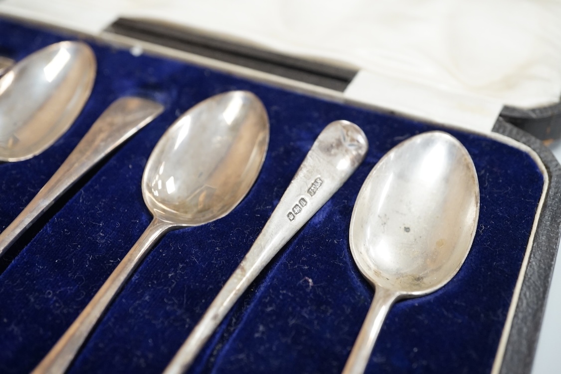 A cased set of six George VI silver teaspoons, James Dixon & Sons, Sheffield, 1948, a cased set of six silver and polychrome enamel coffee spoons and a cased single silver spoon.